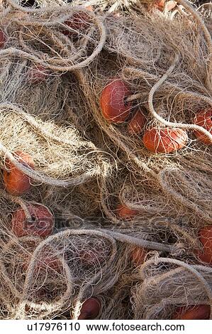 Stock Image - Close up of tangled netting. Fotosearch