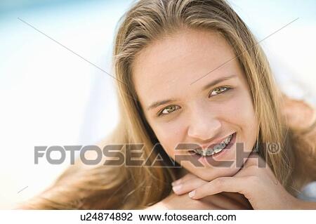 Close up of teenage girl in braces View Large Photo Image Stock Image - Close up of teenage girl in braces. Fotosearch