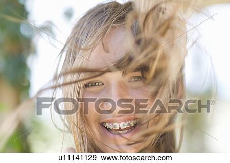 Stock Photo - Close up of teenage girl in braces. Fotosearch