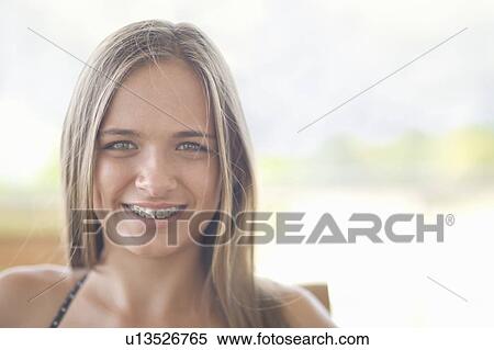 Close up of teenage girl in braces View Large Photo Image Stock Photography - Close up of teenage girl in braces. Fotosearch