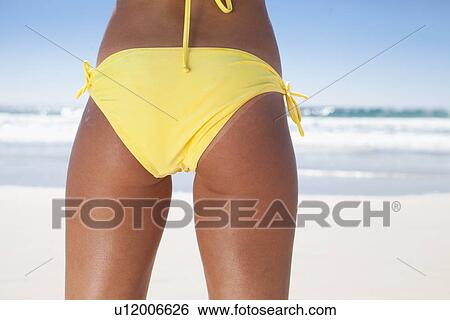 Close up of woman in bikini bottoms View Large Photo Image Stock Photograph - Close up of woman in bikini bottoms. Fotosearch