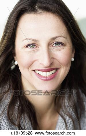 Stock Photo - Close up of womans smiling face. Fotosearch