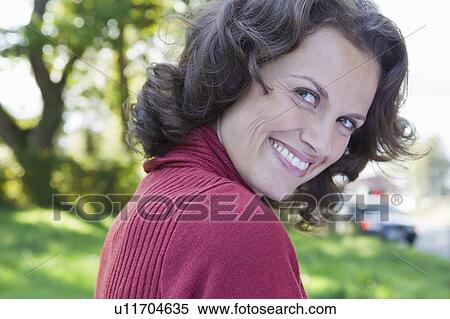 Close up of womans smiling face View Large Photo Image Stock Photography - Close up of womans smiling face. Fotosearch
