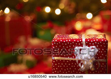 Stock Image - Close up of wrapped Christmas gift. Fotosearch