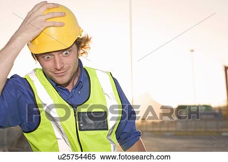 Construction worker wearing hard hat View Large Photo Image Stock Photography - Construction worker wearing hard hat. Fotosearch
