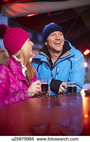 Couple having coffee outdoors in winter View Large Photo Image Picture - Couple having coffee outdoors in winter. Fotosearch