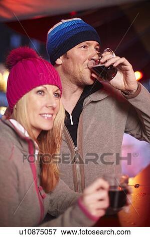 Couple having coffee outdoors in winter View Large Photo Image Stock Photo - Couple having coffee outdoors in winter. Fotosearch