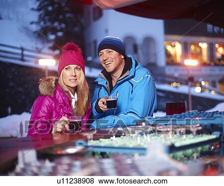 Couple having coffee outdoors in winter View Large Photo Image Stock Photo - Couple having coffee outdoors in winter. Fotosearch