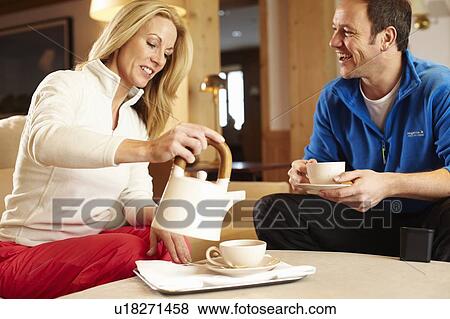 Couple having cup of tea together View Large Photo Image Stock Photo - Couple having cup of tea together. Fotosearch