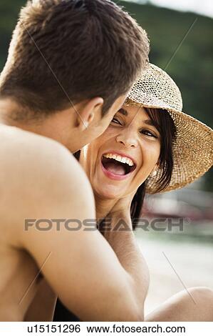 Couple laughing on beach View Large Photo Image Stock Photograph - Couple laughing on beach. Fotosearch