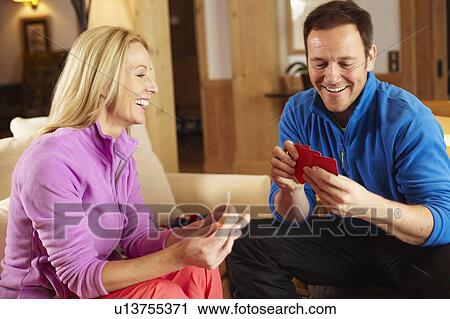 Couple playing card games together View Large Photo Image Stock Image - Couple playing card games together. Fotosearch
