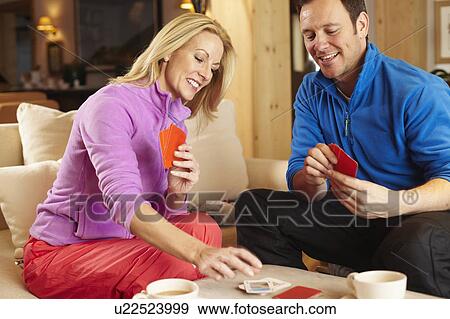 Couple playing card games together View Large Photo Image Stock Photo - Couple playing card games together. Fotosearch