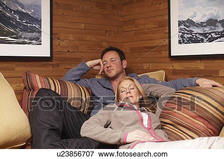 Stock Photo - Couple sleeping on sofa together. Fotosearch
