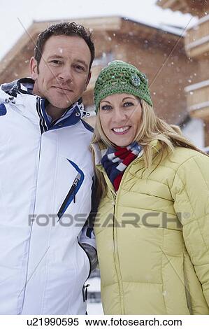 Couple smiling together in snow View Large Photo Image Stock Photography - Couple smiling together in snow. Fotosearch