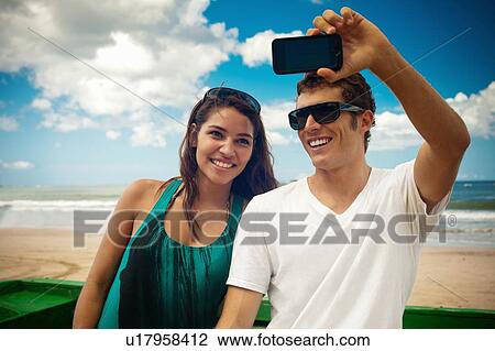 Couple taking picture of themselves View Large Photo Image Stock Image - Couple taking picture of themselves. Fotosearch