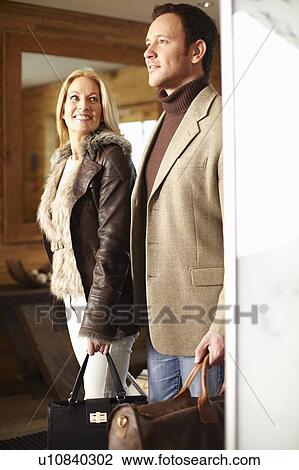 Couple walking in hotel lobby View Large Photo Image Stock Image - Couple walking in hotel lobby. Fotosearch