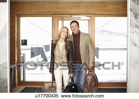 Couple walking in hotel lobby View Large Photo Image Stock Photography - Couple walking in hotel lobby. Fotosearch