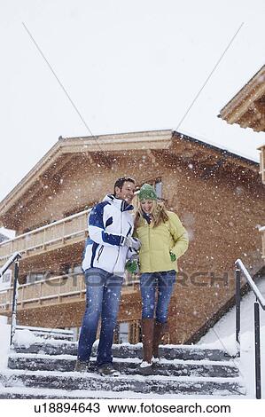 Couple walking together in snow View Large Photo Image Stock Image - Couple walking together in snow. Fotosearch
