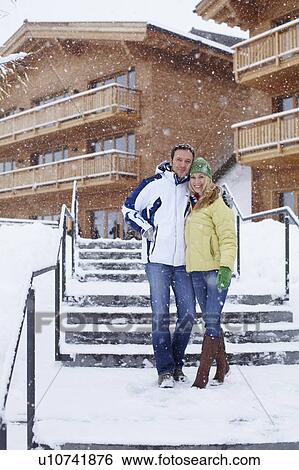 Couple walking together in snow View Large Photo Image Stock Photograph - Couple walking together in snow. Fotosearch
