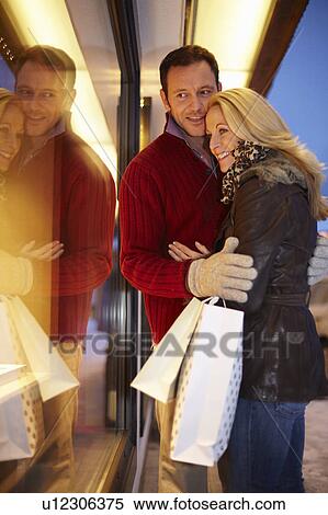 Stock Photography - Couple window shopping together. Fotosearch