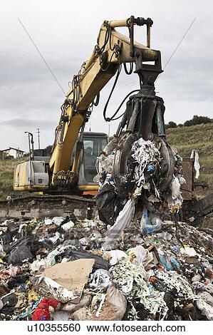 Crane at garbage collection center View Large Photo Image Stock Image - Crane at garbage collection center. Fotosearch
