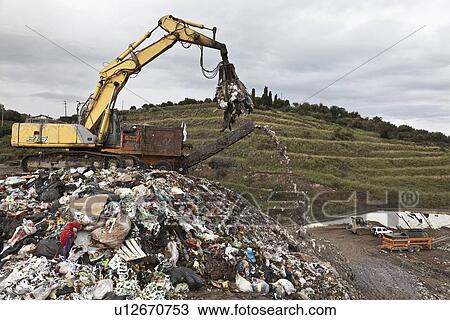 Crane at garbage collection center View Large Photo Image Stock Image - Crane at garbage collection center. Fotosearch