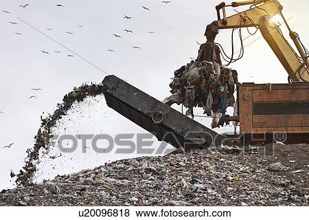 Stock Photo - Crane at garbage collection center. Fotosearch