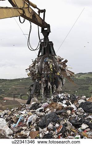 Crane at garbage collection center View Large Photo Image Stock Photograph - Crane at garbage collection center. Fotosearch