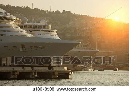 Stock Photo - Cruise ships docked in urban pier. Fotosearch
