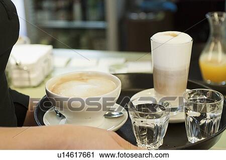 Cups of coffee on serving tray View Large Photo Image Stock Image - Cups of coffee on serving tray. Fotosearch