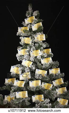 Euro bills on Christmas tree View Large Photo Image Stock Image - Euro bills on Christmas tree. Fotosearch