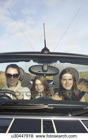 Stock Photo - Family driving in rural landscape. Fotosearch