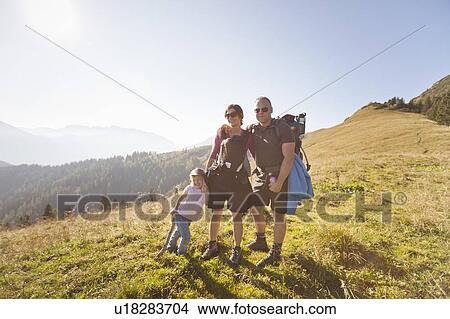 Family hiking together on hillside View Large Photo Image Picture - Family hiking together on hillside. Fotosearch