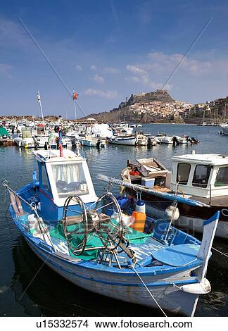 Fishing boats docked in pier View Large Photo Image Picture - Fishing boats docked in pier. Fotosearch