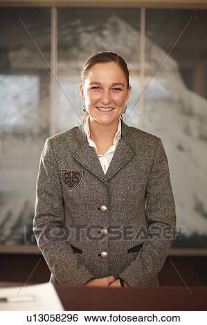 Hotel concierge standing at desk View Large Photo Image Stock Photograph - Hotel concierge standing at desk. Fotosearch