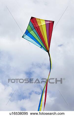 Kite flying in cloudy sky View Large Photo Image Stock Photography - Kite flying in cloudy sky. Fotosearch