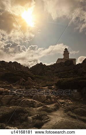 Lighthouse on rocky coastline View Large Photo Image Stock Image - Lighthouse on rocky coastline. Fotosearch