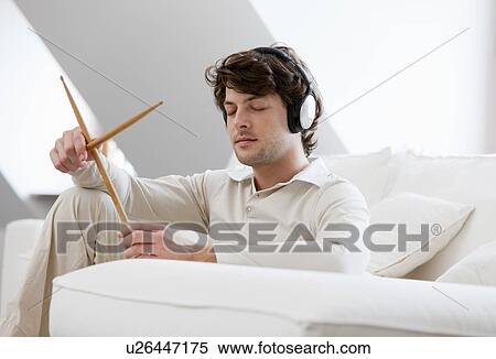 Man playing with drumsticks View Large Photo Image Stock Photography - Man playing with drumsticks. Fotosearch