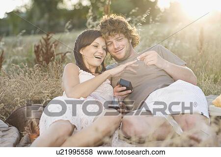 Man proposing to girlfriend at picnic View Large Photo Image Stock Photo - Man proposing to girlfriend at picnic. Fotosearch