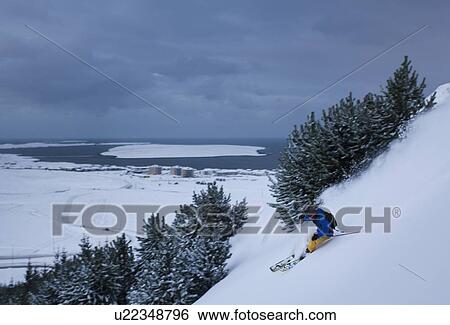 Man skiing on snowy hillside View Large Photo Image Stock Photograph - Man skiing on snowy hillside. Fotosearch