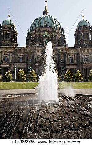 Modern fountain and ornate building View Large Photo Image Stock Photograph - Modern fountain and ornate building. Fotosearch