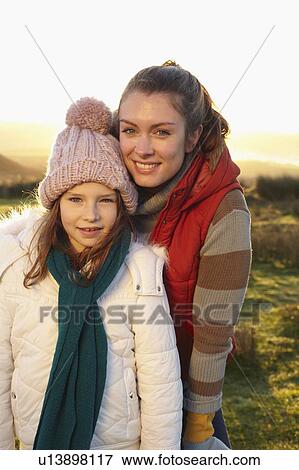 Stock Photo - Mother and daughter smiling outdoors. Fotosearch