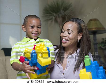 Mother and son playing with Legos View Large Photo Image Stock Image - Mother and son playing with Legos. Fotosearch