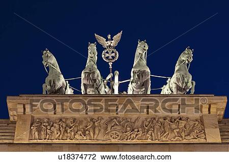 Stock Image - Ornate statues on columned building. Fotosearch