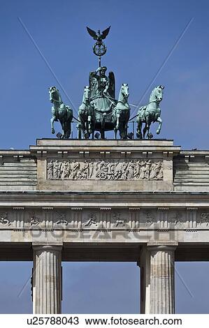 Stock Image - Ornate statues on columned building. Fotosearch