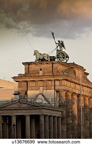 Ornate statues on columned building View Large Photo Image Stock Photo - Ornate statues on columned building. Fotosearch