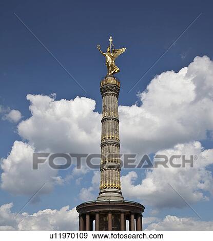 Ornate tower against blue sky View Large Photo Image Stock Photo - Ornate tower against blue sky. Fotosearch
