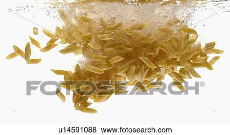 Stock Photo - Pasta splashing in water. Fotosearch