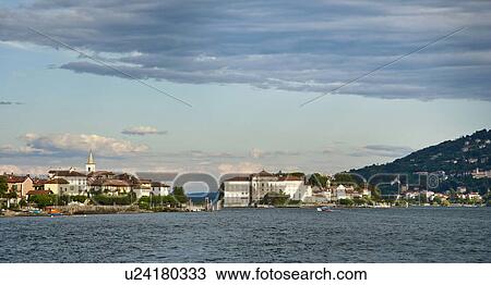 Stock Image - Pier and buildings on waterfront. Fotosearch