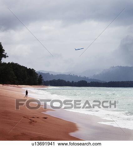 Plane flying over tropical beach View Large Photo Image Stock Image - Plane flying over tropical beach. Fotosearch